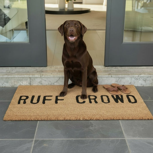 FULL MOOD Ruff Crowd natural coir doormat with black text, featuring a chocolate lab dog sitting on it.