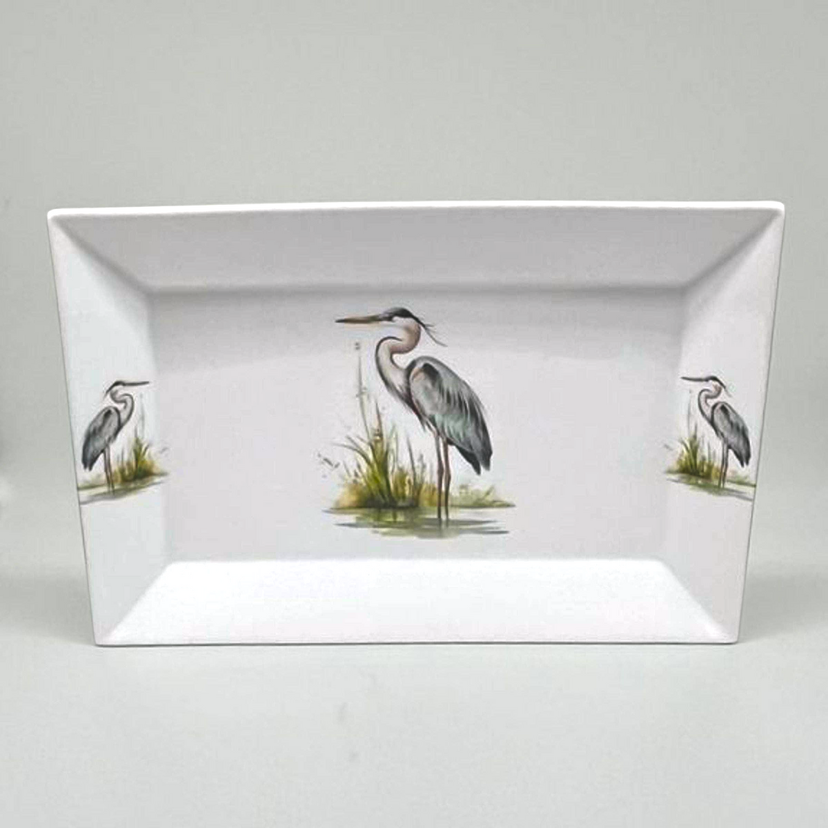 FULL MOOD rectangular porcelain serving platter featuring a detailed blue heron bird motif on a white background.