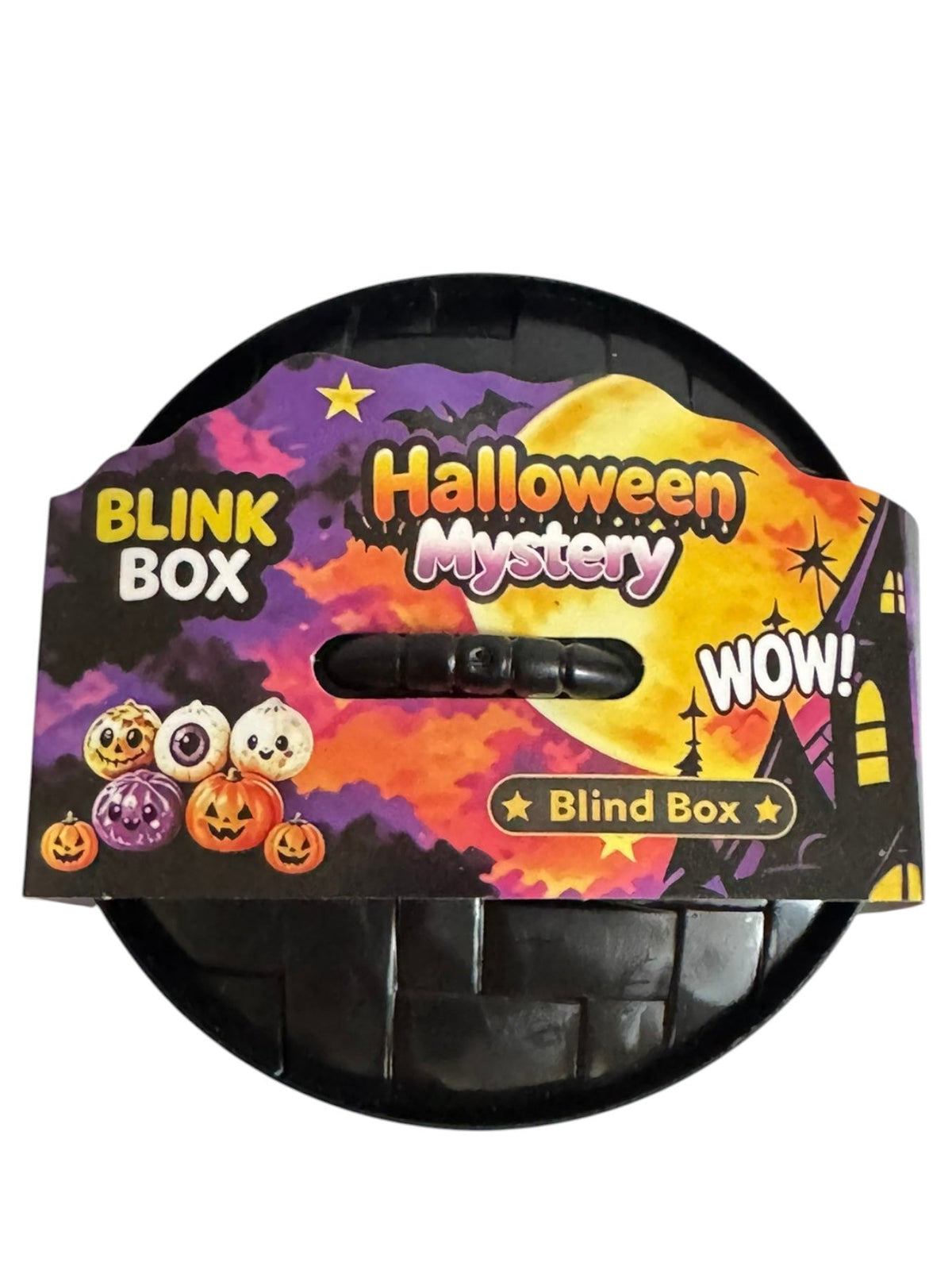 A circular black plastic Halloween mystery blind box with a colorful printed cardboard insert. The insert features festive graphics including jack-o'-lanterns, a full moon, and the text 'Halloween Mystery', 'BLINK BOX', and 'WOW!'.