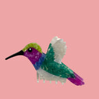 Decorative hairclip  with a colorful hummingbird design.
