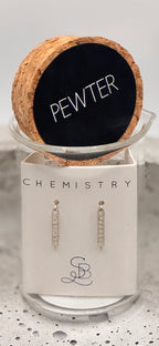 Jewelry set with earrings on a branded card labeled 'Pewter' and 'Chemistry' with cork lid.