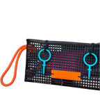 FULL MOOD The Clutch oyster bag in black mesh with bright orange rope handle and vibrant blue accents on a beach table