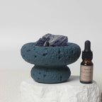 FULL MOOD Caribbean aromatherapy diffuser with blue sodalite gemstones in a textured blue vessel and fragrance oil