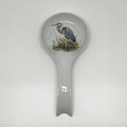 FULL MOOD ceramic spoon rest featuring a detailed blue heron illustration on a white glazed finish for kitchen decor