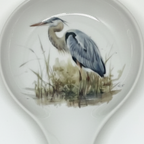 FULL MOOD ceramic spoon rest featuring a detailed blue heron illustration on a white glazed surface for kitchen use.