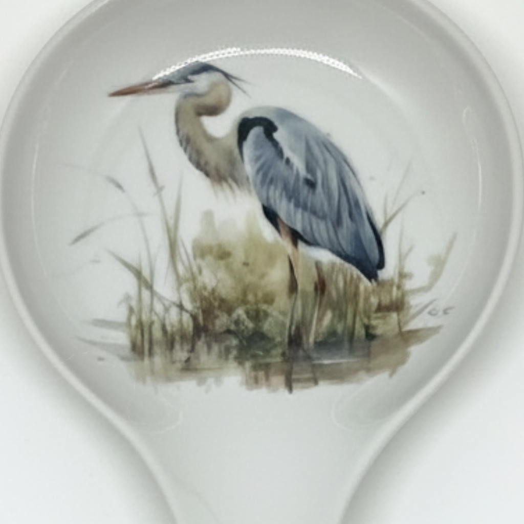 FULL MOOD ceramic spoon rest featuring a detailed blue heron illustration on a white glazed surface for kitchen use.