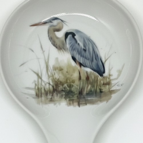 FULL MOOD ceramic spoon rest featuring a detailed blue heron illustration on a white glazed surface for kitchen use.