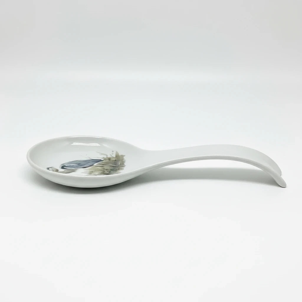 FULL MOOD ceramic spoon rest featuring a blue heron illustration on a white glazed surface for kitchen organization