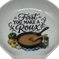 FULL MOOD ceramic spoon rest featuring a cast iron skillet illustration and the text First You Make a Roux
