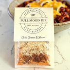 FULL MOOD Chili Cheese & Bacon seasoning dip mix packet with visible spices and bacon bits on a white surface