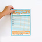 FULL MOOD chore chart sticky notepad with blue grid, task list, and weekly performance review section.