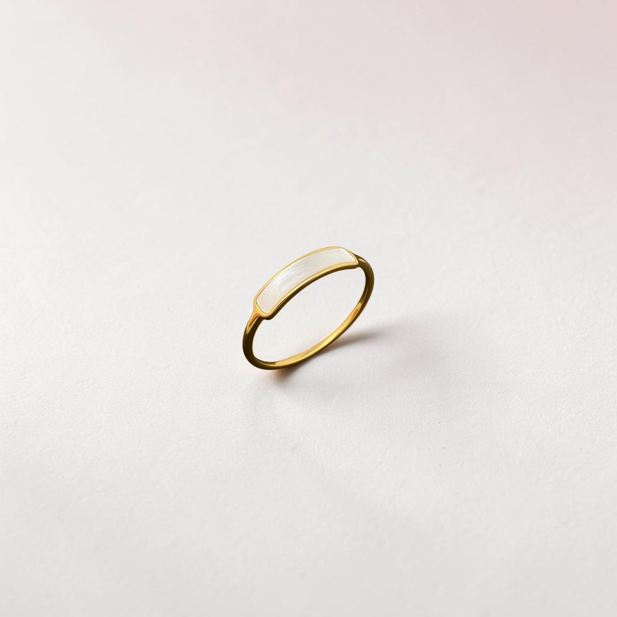 FULL MOOD curved shell ring in 18K gold plated stainless steel with a high polish finish on a white background.