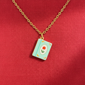 FULL MOOD 18K gold-plated stainless steel necklace featuring a light blue enamel book pendant with a red flower.