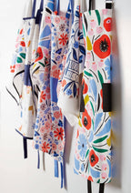 FULL MOOD collection of Elizabeth Olwen cotton kitchen towels featuring vibrant floral patterns and screen prints.