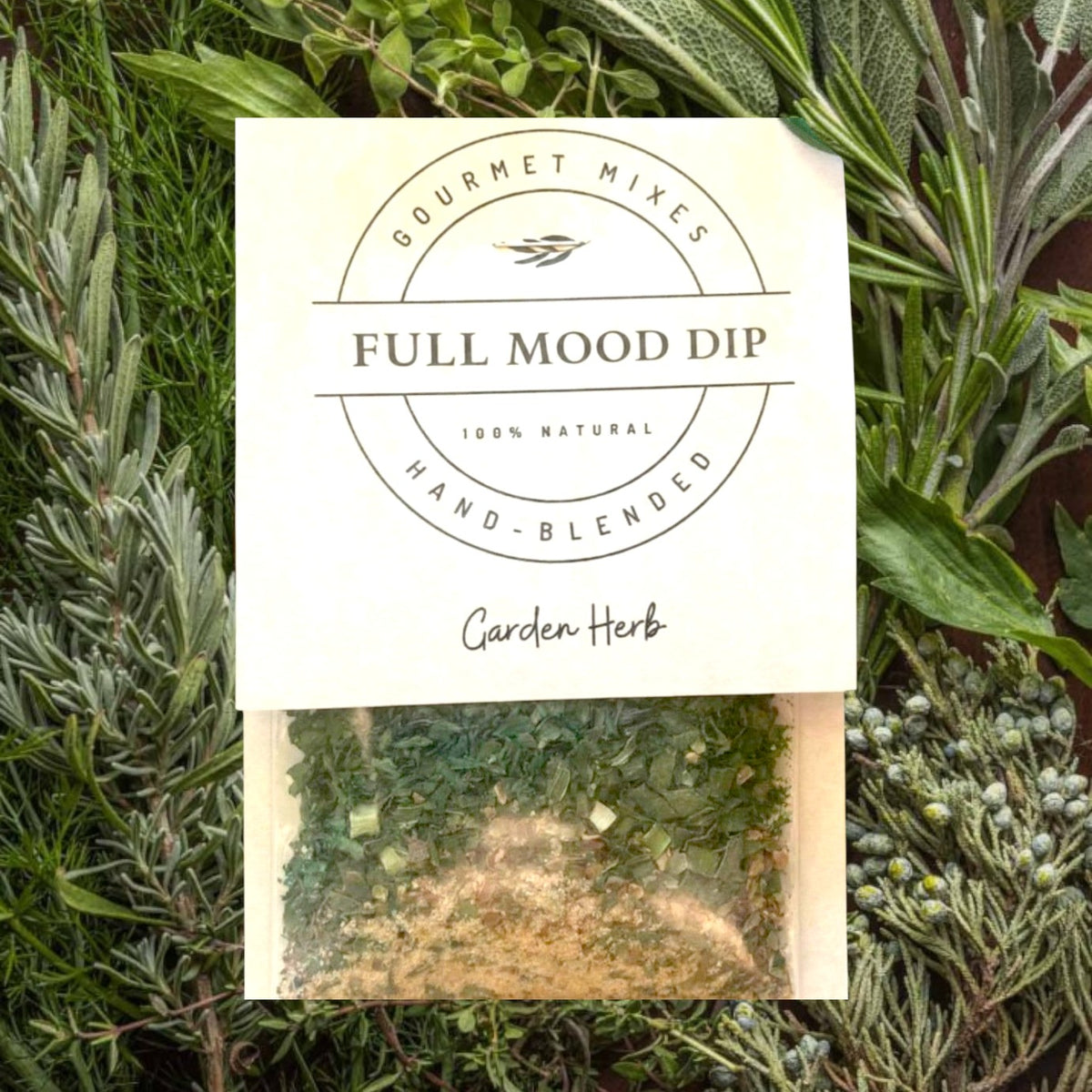 FULL MOOD Garden Herb seasoning dip mix in a clear pouch with a beige label on a rustic white wooden surface