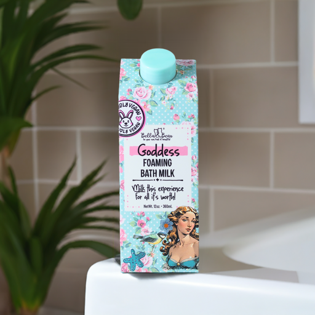 FULL MOOD Goddess Foaming Bath Milk in a floral carton with vintage art, sitting on a white bathroom ledge.