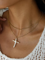 FULL MOOD 18K gold double-layered chain necklace featuring a freshwater pearl cross pendant worn on a model