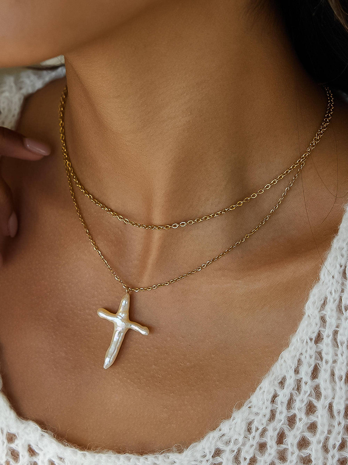 FULL MOOD 18K gold double-layered chain necklace featuring a freshwater pearl cross pendant worn on a model