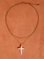 FULL MOOD 18K gold plated double-layered chain necklace featuring a freshwater pearl cross pendant on orange background