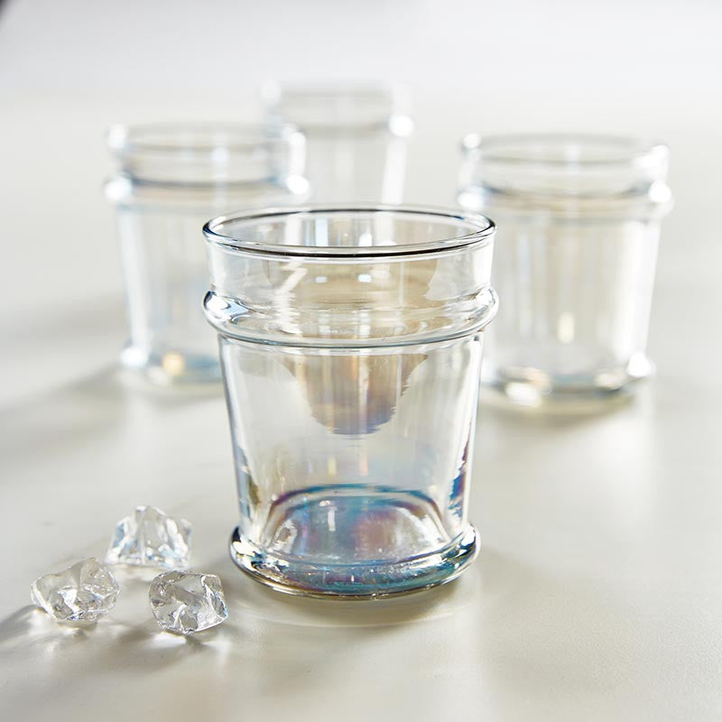 FULL MOOD set of four grey luster glasses with an iridescent shimmer on a white surface for elegant table settings.