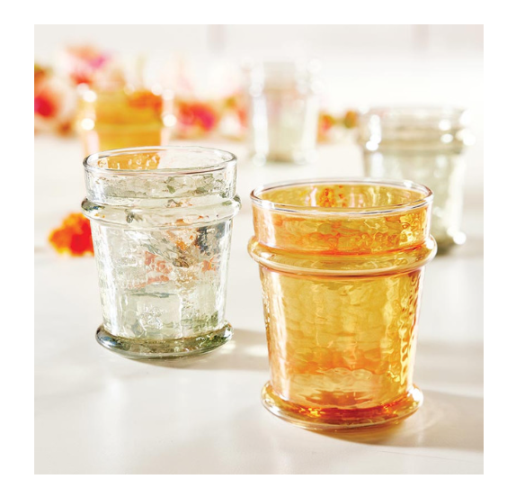 FULL MOOD set of four elegant grey luster glasses with an iridescent shimmer on a white table setting.