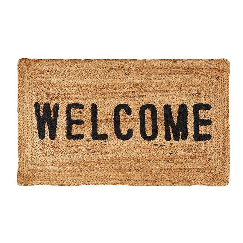 FULL MOOD woven jute doormat with black "WELCOME" lettering. Natural, rustic texture.