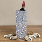 FULL MOOD blue paper wine gift bag with oyster shell print, featuring ribbon handles and real oyster shells on a table