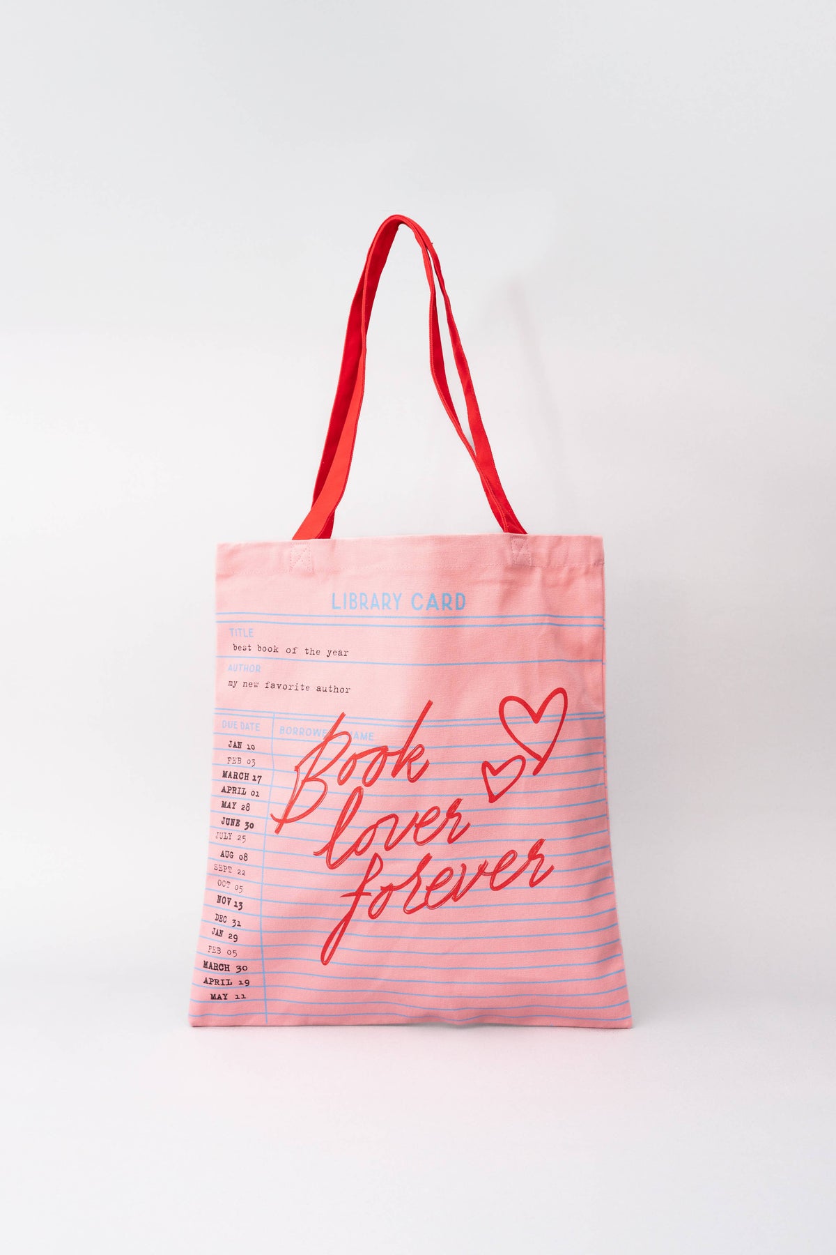 FULL MOOD pink canvas tote bag with a library card print and red Book Lover Forever script text and heart graphics.