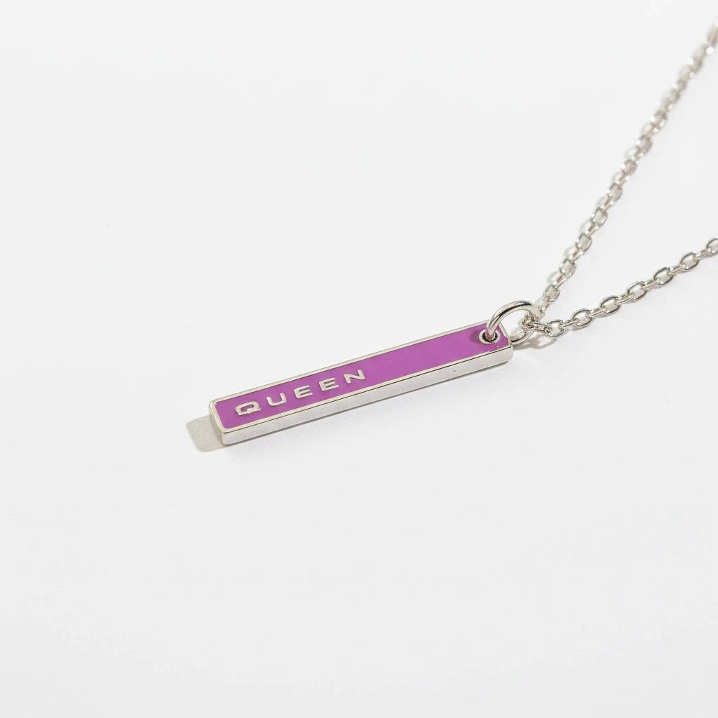 FULL MOOD Queen pendant necklace featuring a purple enamel vertical bar with silver lettering on a delicate chain