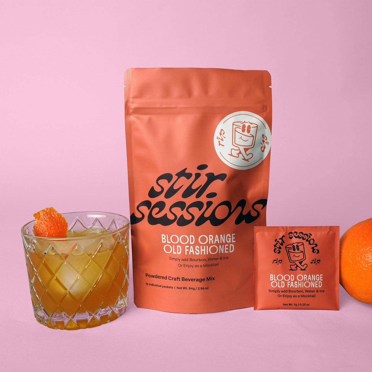 FULL MOOD Stir Sessions Blood Orange Old Fashioned cocktail mix pouch and single packet with a prepared drink.
