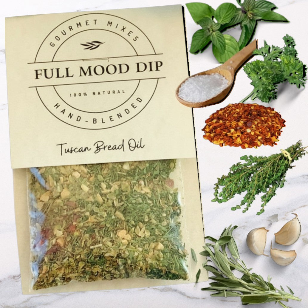 FULL MOOD Tuscan seasoning dip mix packet with fresh parsley, sage, garlic, red pepper, and thyme on marble surface