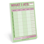 FULL MOOD What I Ate large sticky pad with a green and pink weekly meal tracking grid and hydration checkboxes.