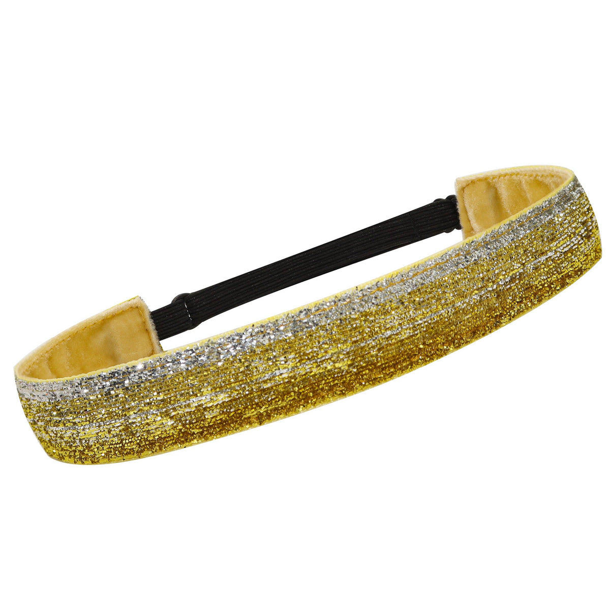 A wide, stretchy headband featuring a textured gold and silver glitter pattern on the front, with a black elastic band and a beige fabric lining visible inside.