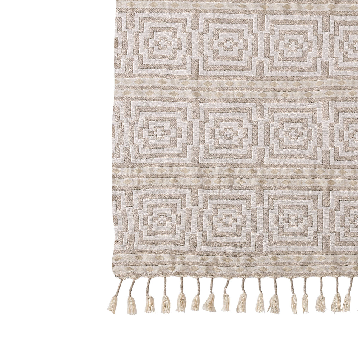 Beige patterned rug with tassels on a white background